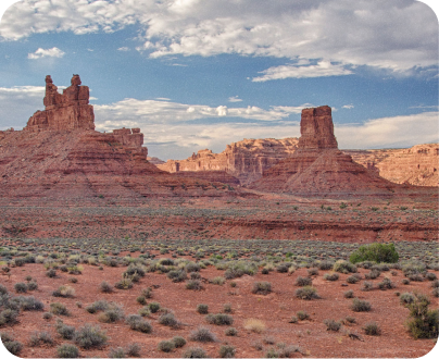 distant photo of 2 immense peaks of the Colorado canyon