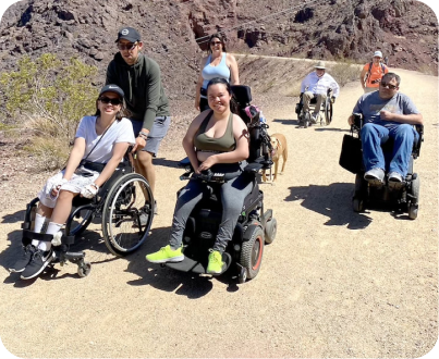 People looking at camera on accessible trail